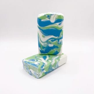 Two bars of white, blue and green soap
