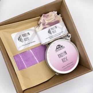 Rose gift collection comprising soap, sprinkles and body cream, in a presentation box
