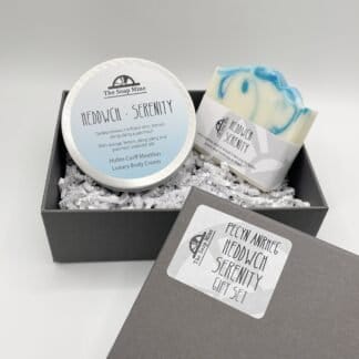 A gift set comprising one Serenity blue and white soap and a pot of body cream