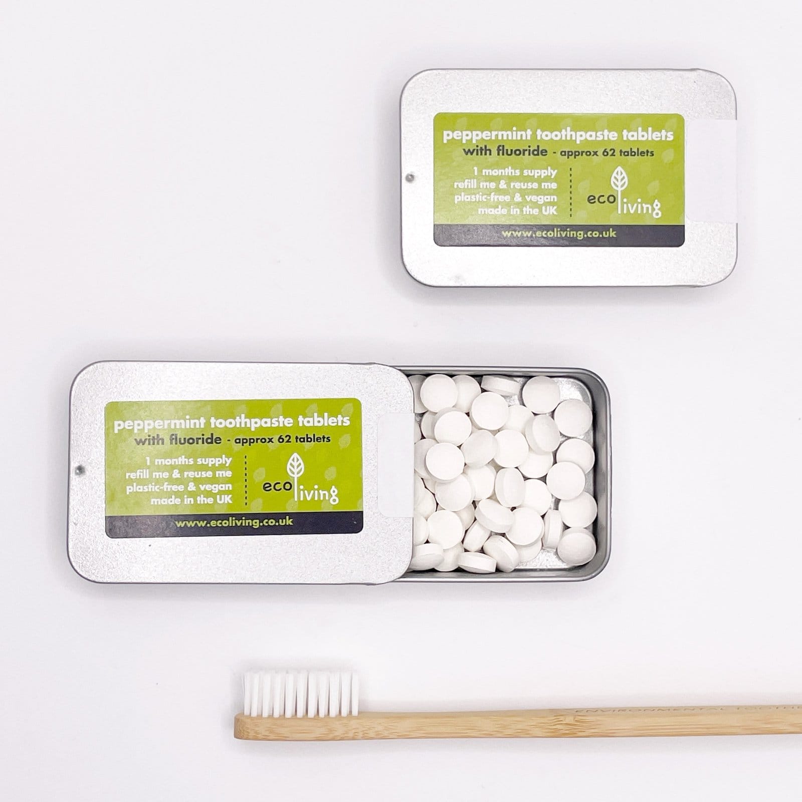 Solid toothpaste tablets in a tin