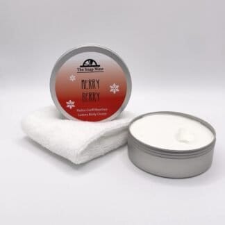 An open tin of Merry Berry Body Cream