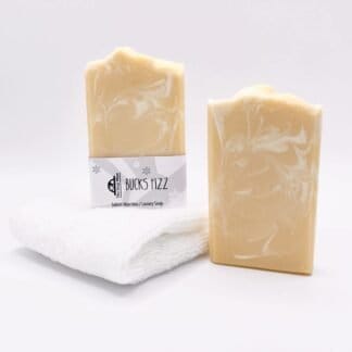 Two bars of yellow and white handmade soap