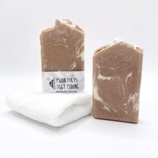 Two bars of brown and white handmade soap