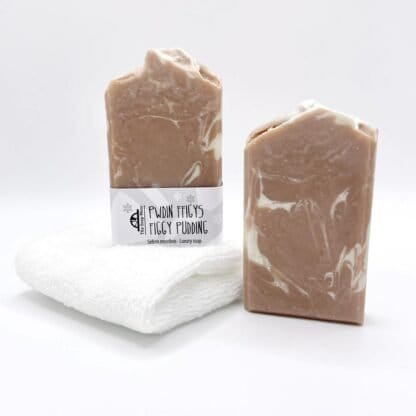 Two bars of brown and white handmade soap