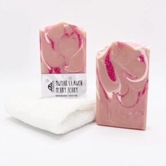 Two bars of pink, white and red handmade soap