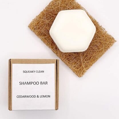 Cedarwood & Lemon Shampoo bar on a soap saver with its box by its side