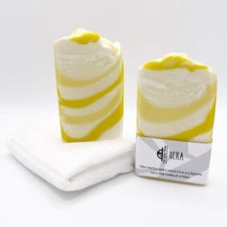 Two bars of white and yellow handmade soap