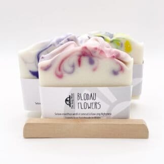 Three soap bars and a wooden soap ladder