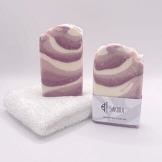 Two bars of pink and white soap
